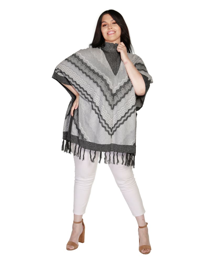 Front of a model wearing a size 0X/1X Plus Size Chevron Fringe Poncho in Heather Grey Combo by Belldini. | dia_product_style_image_id:319464